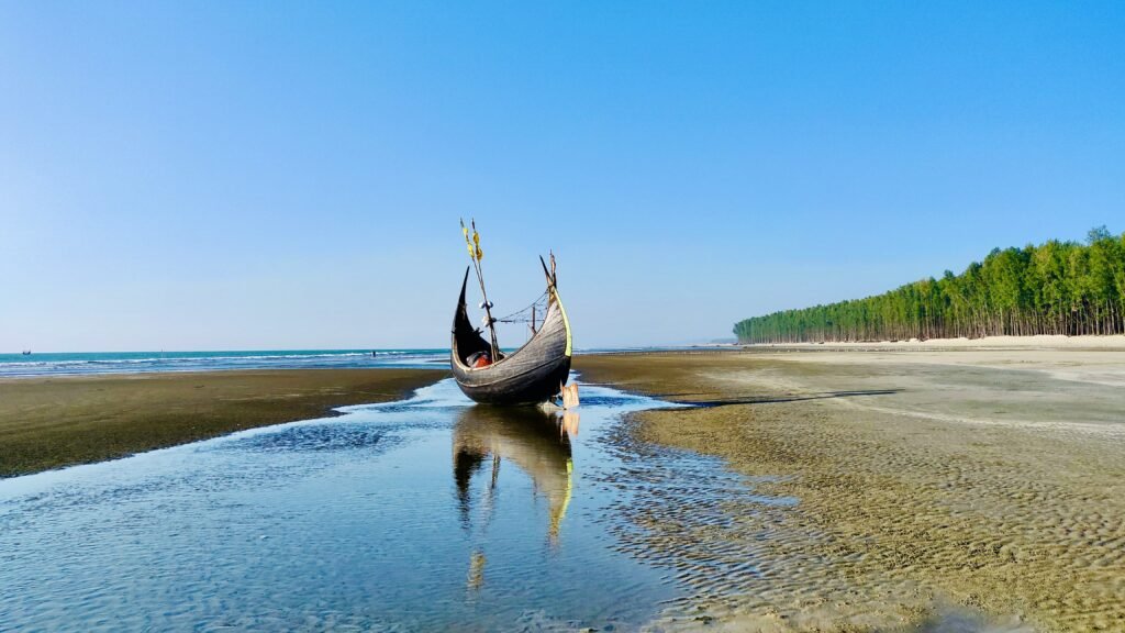 Traditional fishing boat waiting on the shore at Cox's Bazar, Bangladesh